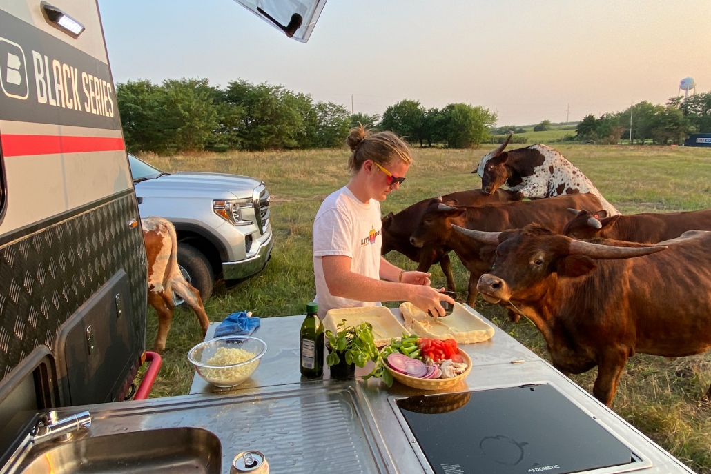 following the trailer camping recipe for cast-iron pizza in the black series outdoor kitchen